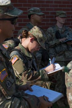 Soldier taking notes during planning phase of exercise
