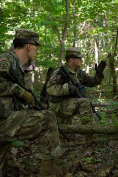 2 soldiers in wooded area