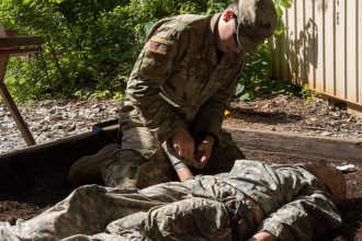A Cadet practices applying first aid.